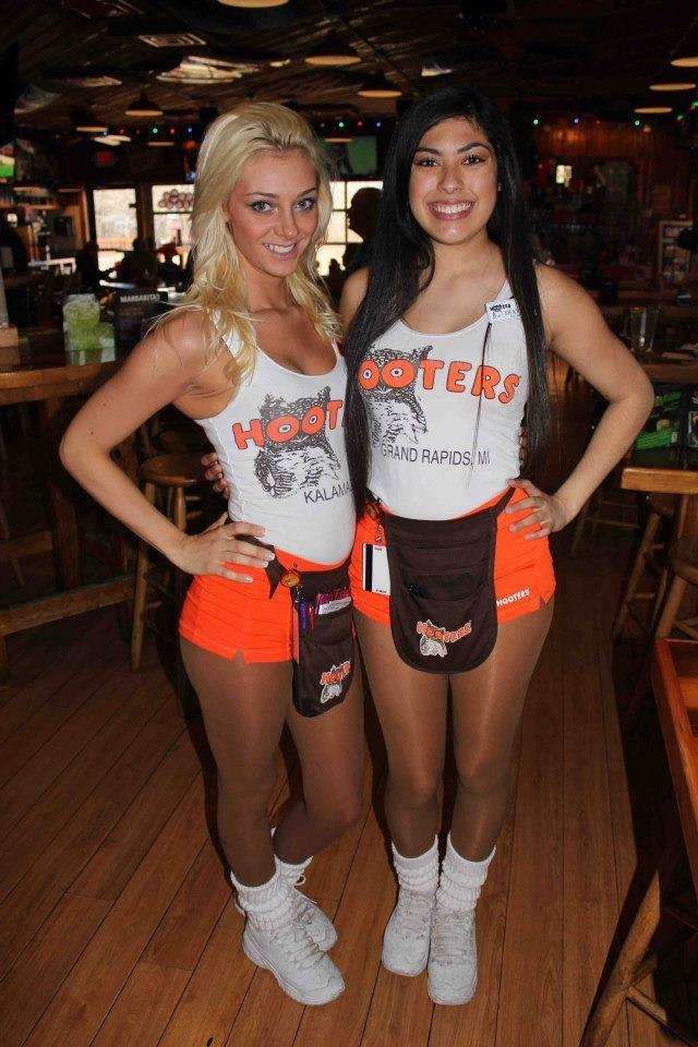 Two Hooters Waitresses wearing Tan Shiny Pantyhose and White Sneakers